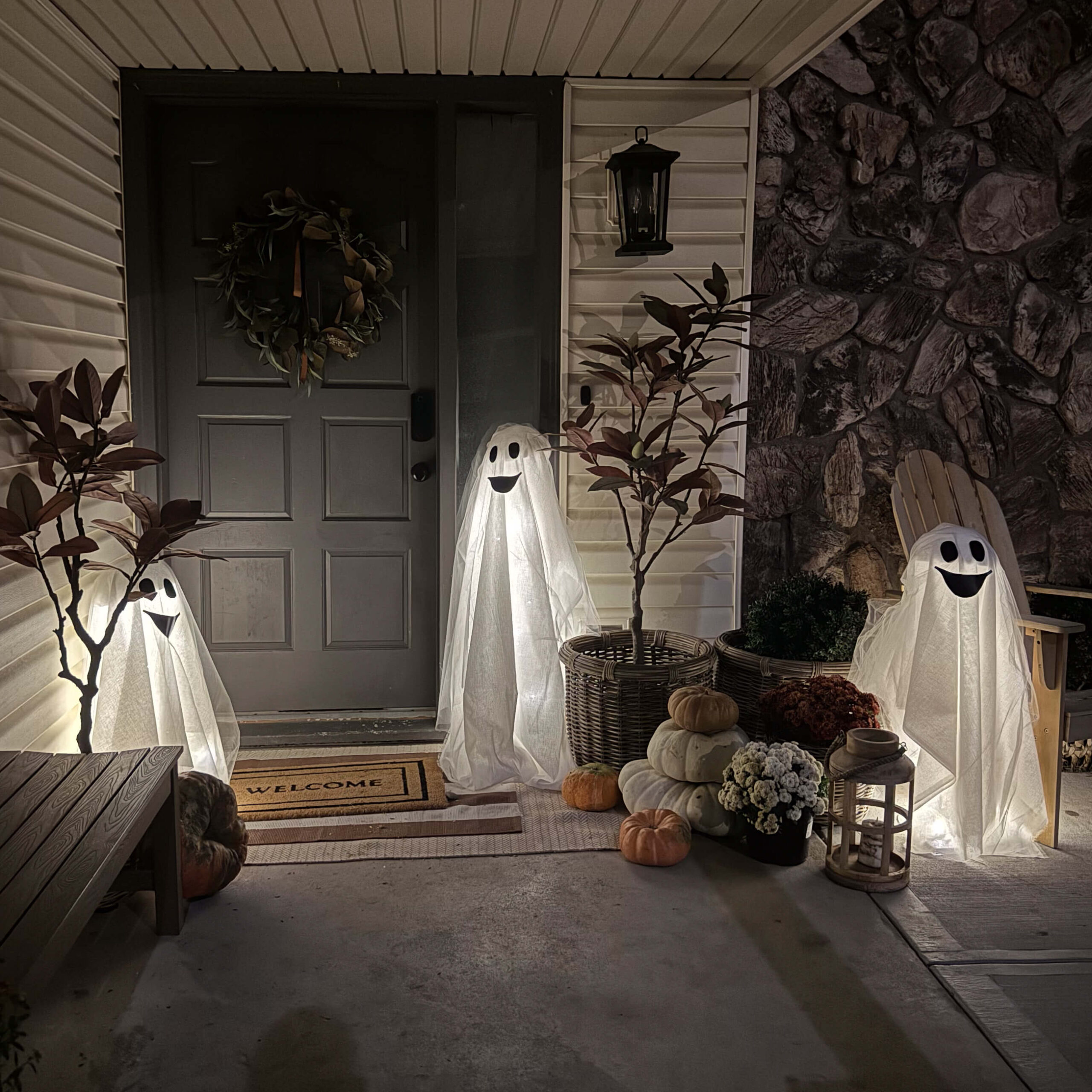 DIY Halloween porch decor with easy-to-make light-up ghosts.