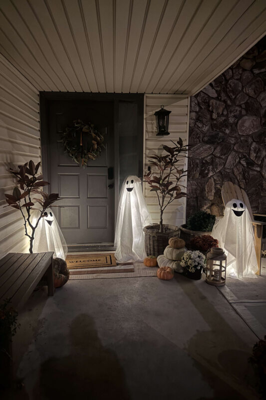 DIY Halloween porch decor with light-up ghosts.