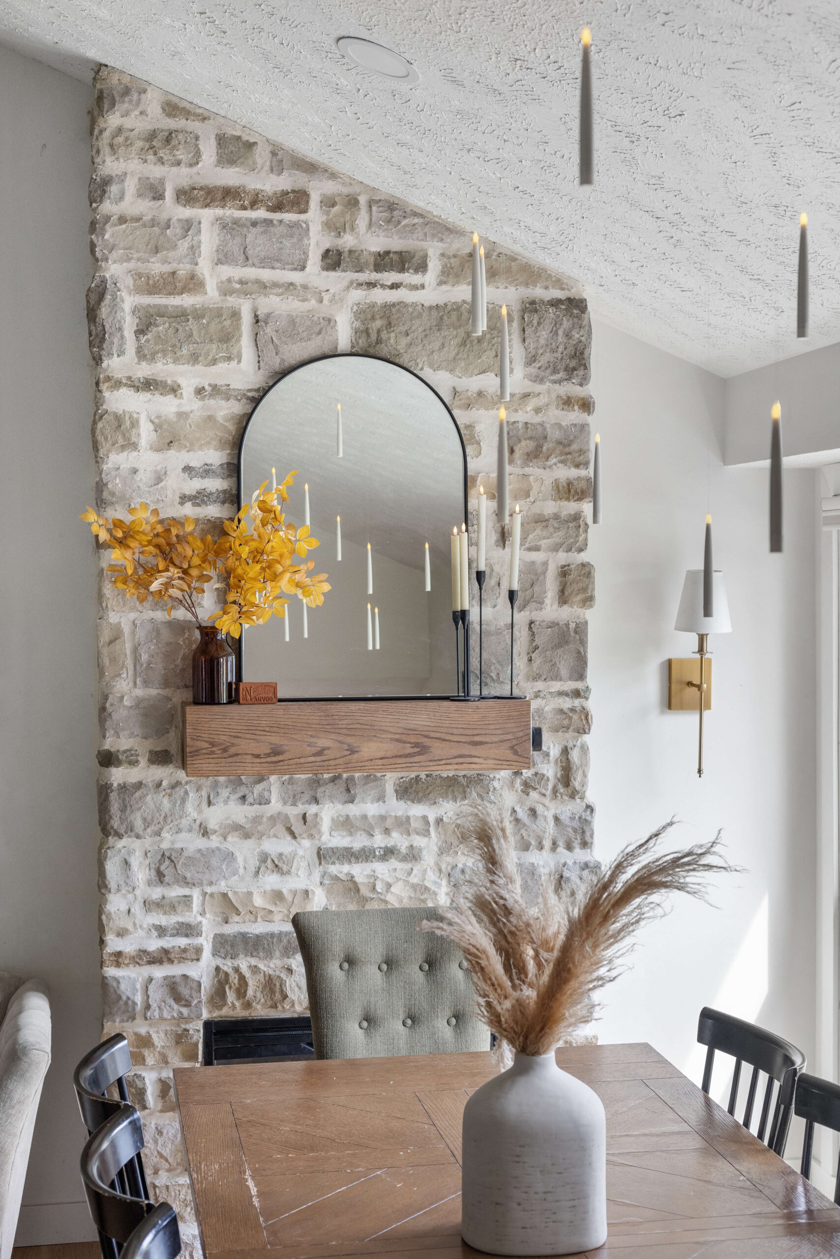 Floating candles hang over a table for elegant Halloween decor.