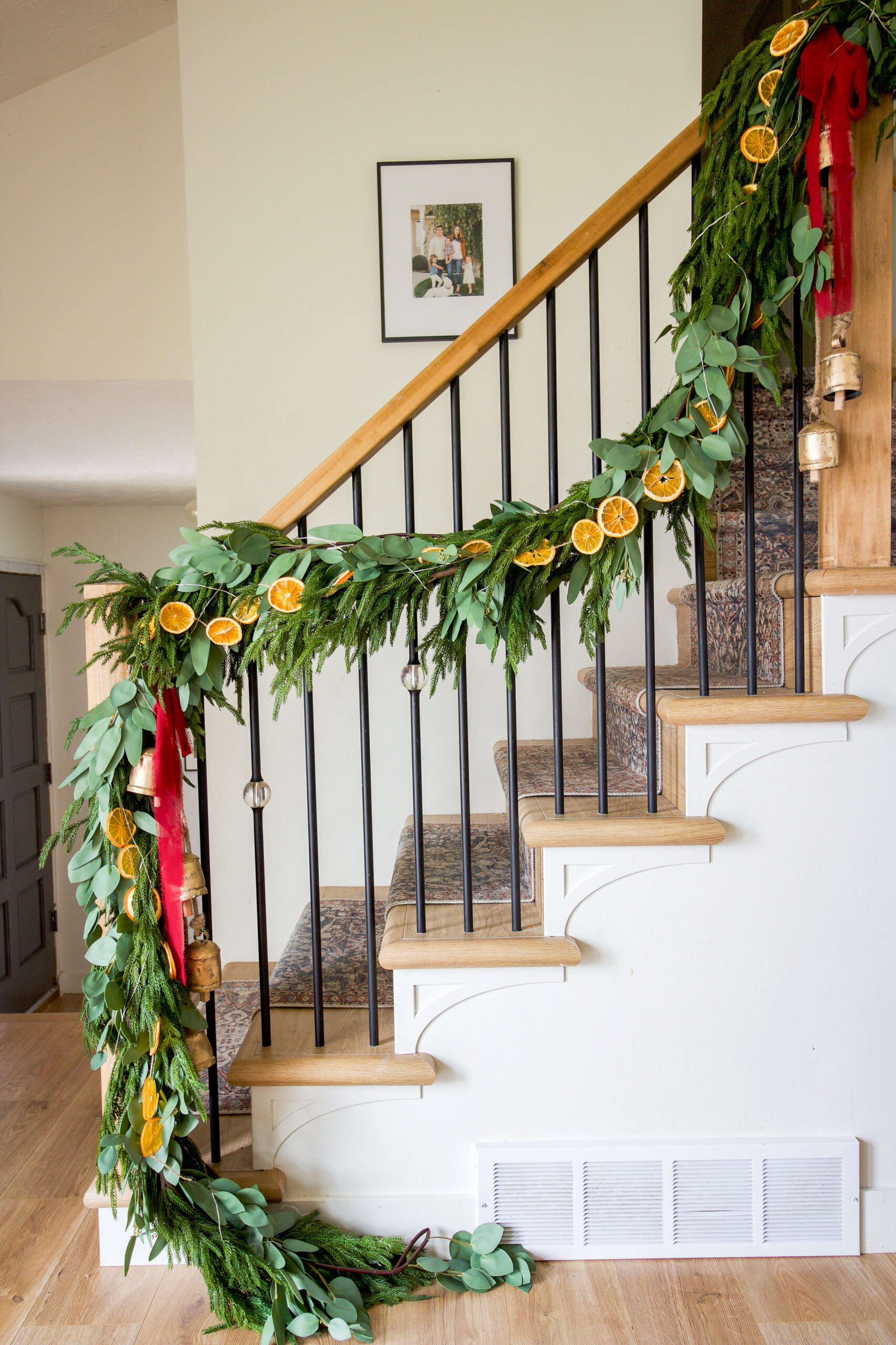 Fully decorated stairs with Christmas garland on a staircase.