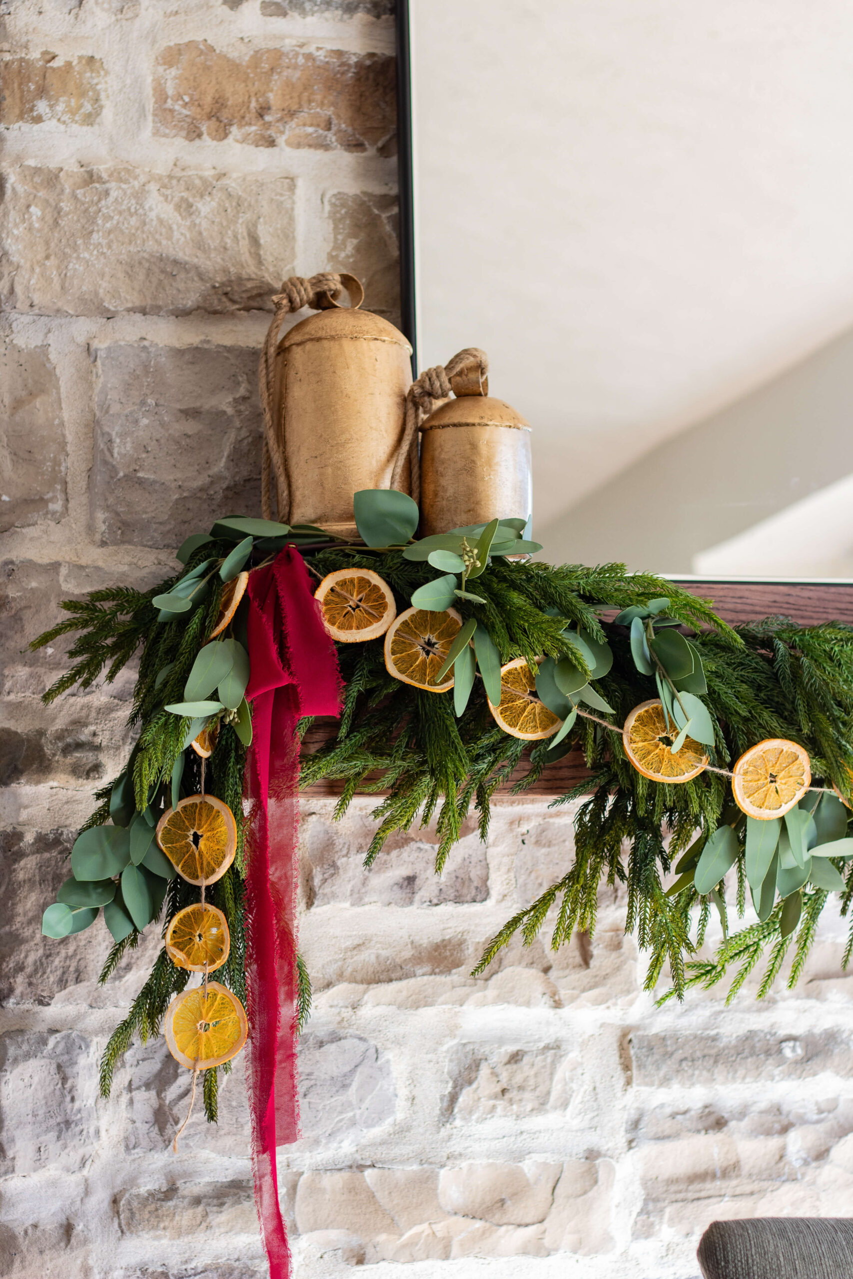 Decorating a fireplace mantel for Christmas.