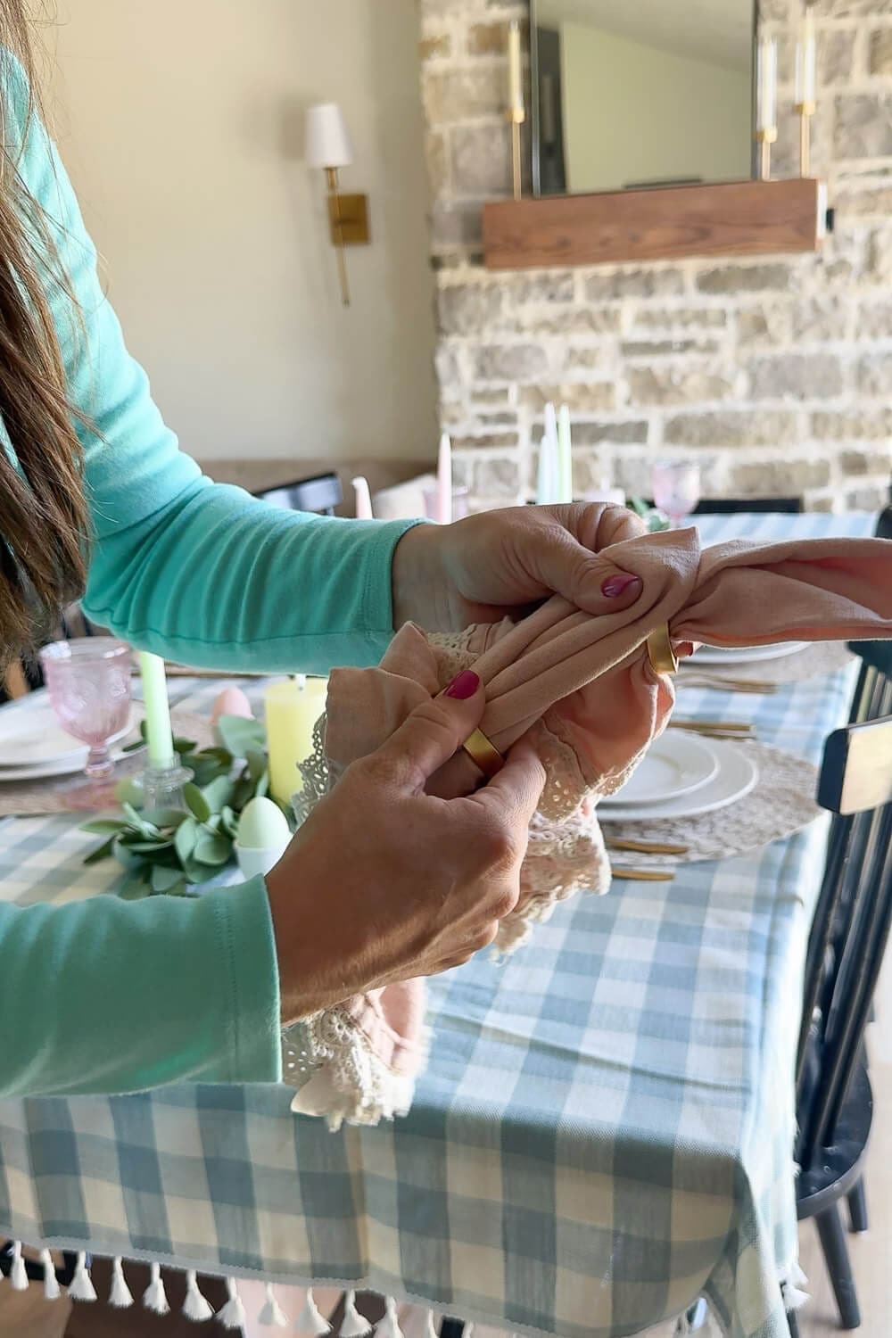 Budget-friendly Easter table decor ideas with reusable eucalyptus garland, flameless pillar candles, and pastel eggs