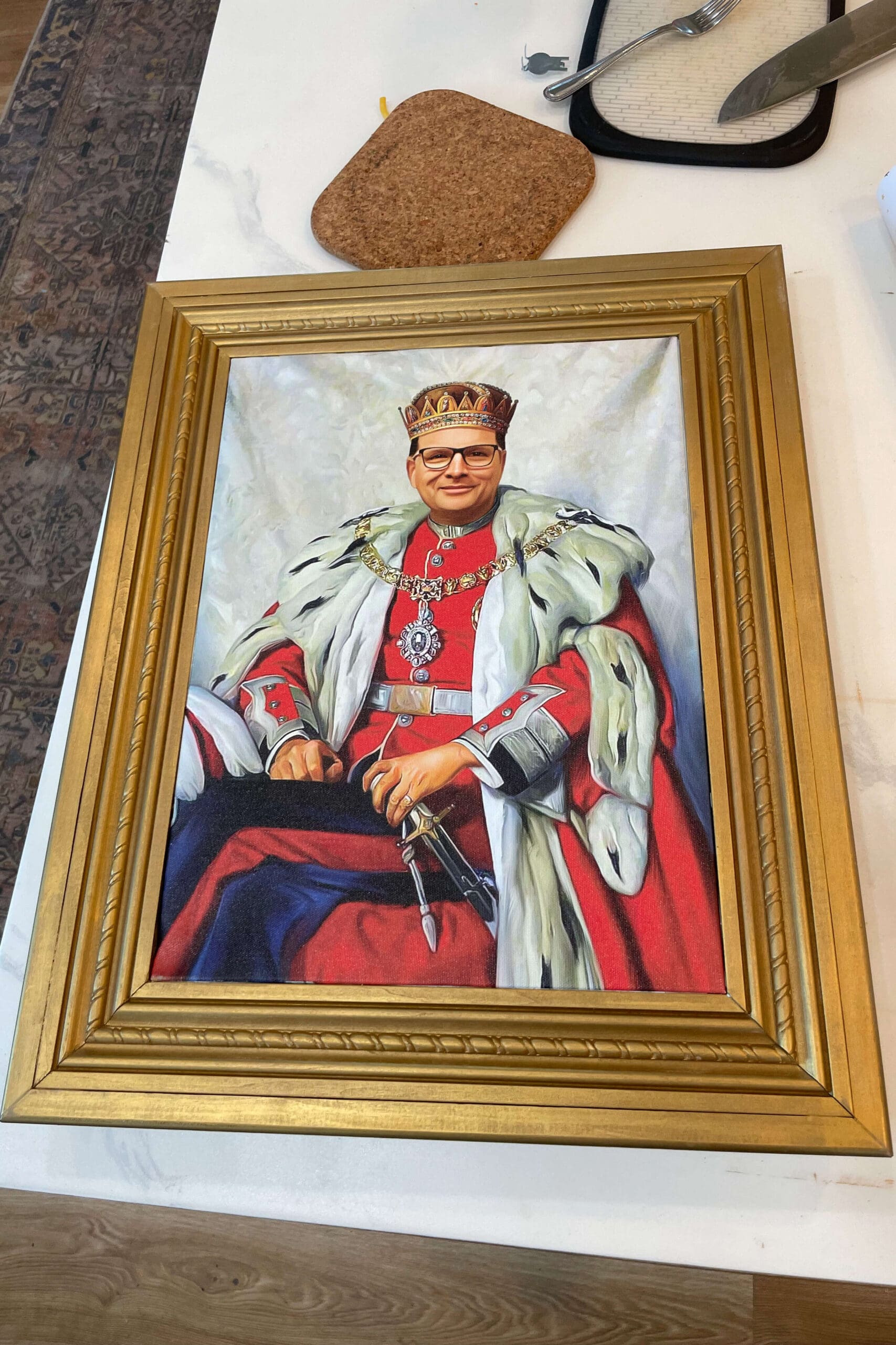 Handmade gold frame showcasing a fun custom Father's Day canvas with royal-themed artwork.