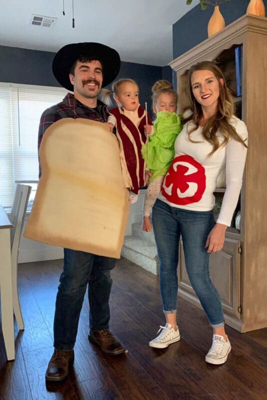 Family costume ideas with a BLT sandwich theme, featuring a slice of bread, bacon, lettuce, and tomato costumes for parents and kids.