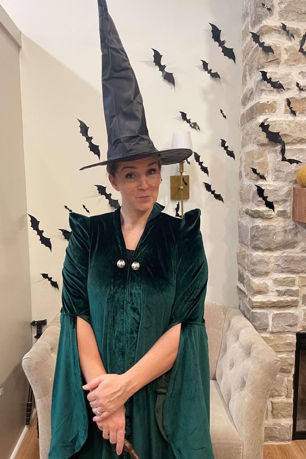 Mom dressed as Professor McGonagall with green robe and tall witch hat.