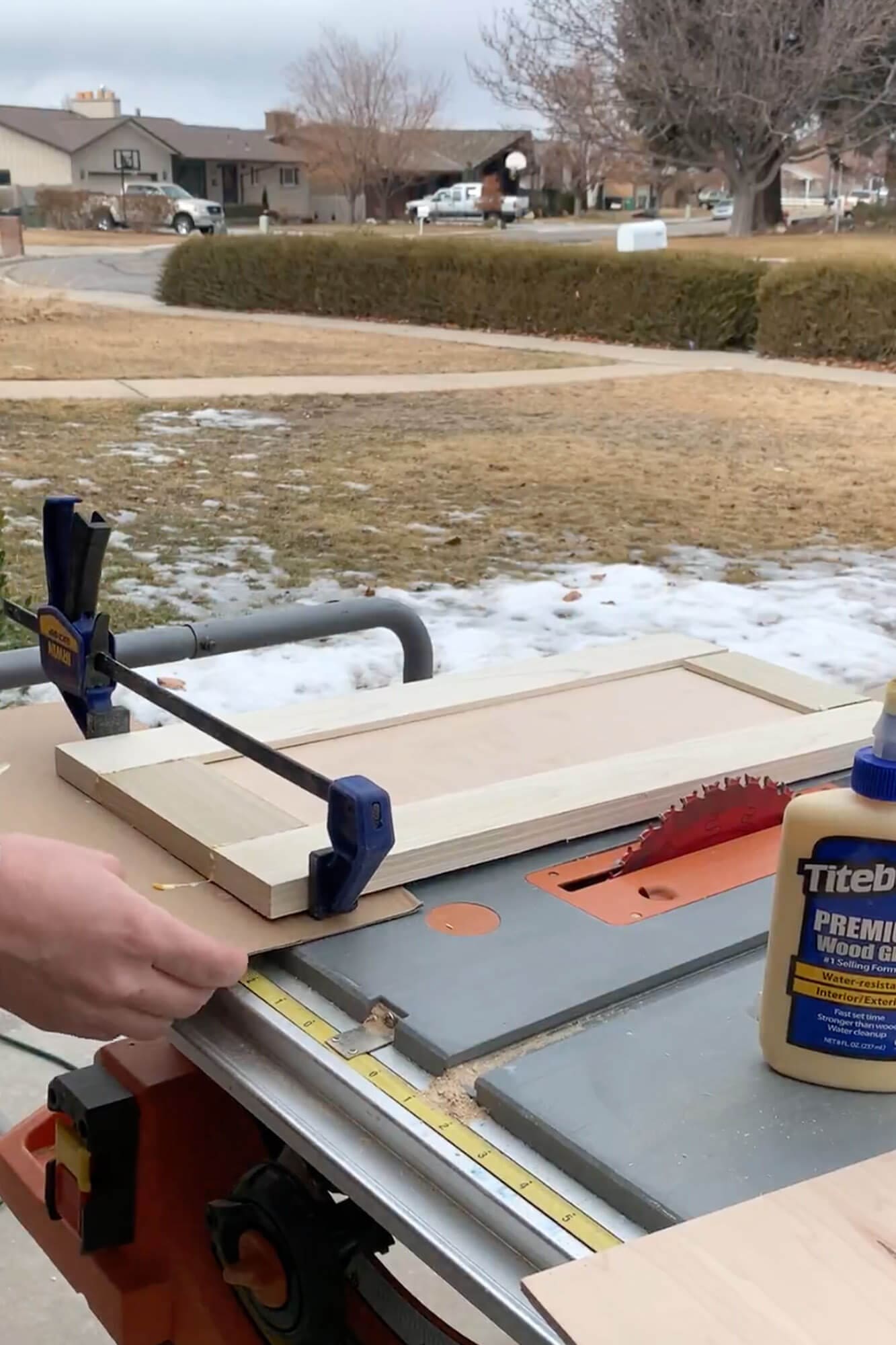 Assembling a shaker cabinet door using clamps on an outdoor workbench