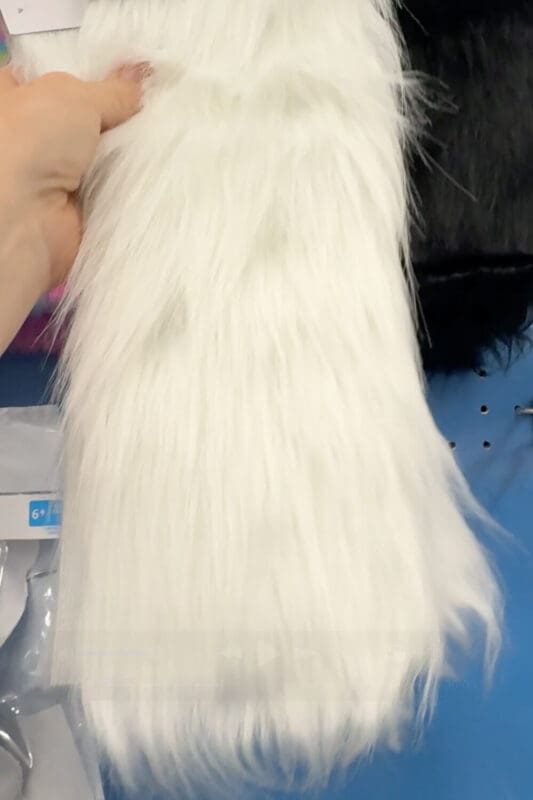 Holding a piece of white faux fur fabric to use for the beard on a handmade gnome costume.