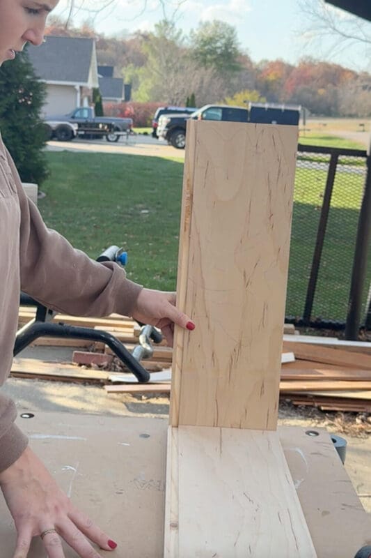 Assembling a custom kitchen drawer organizer in place on the drawer base to test the groove fit.