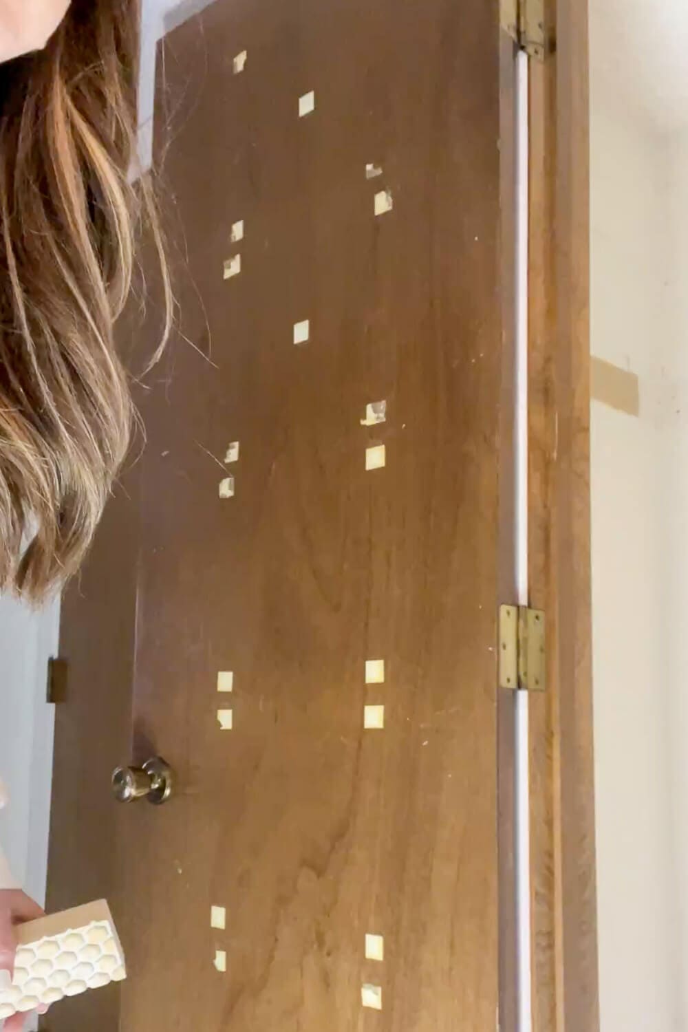 Adhesive squares left on interior door after mirror removal