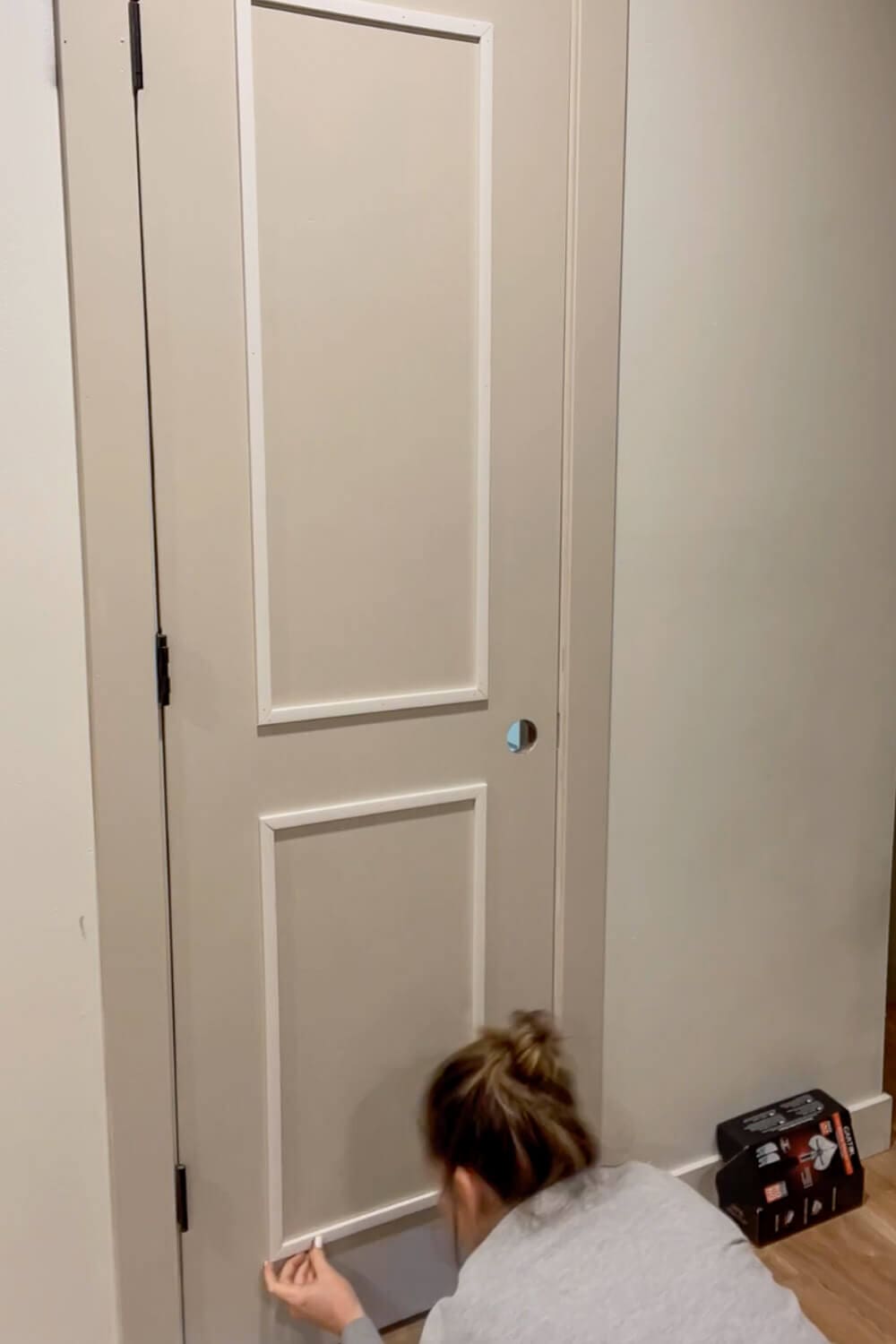 Two trim panels installed on interior door before caulking