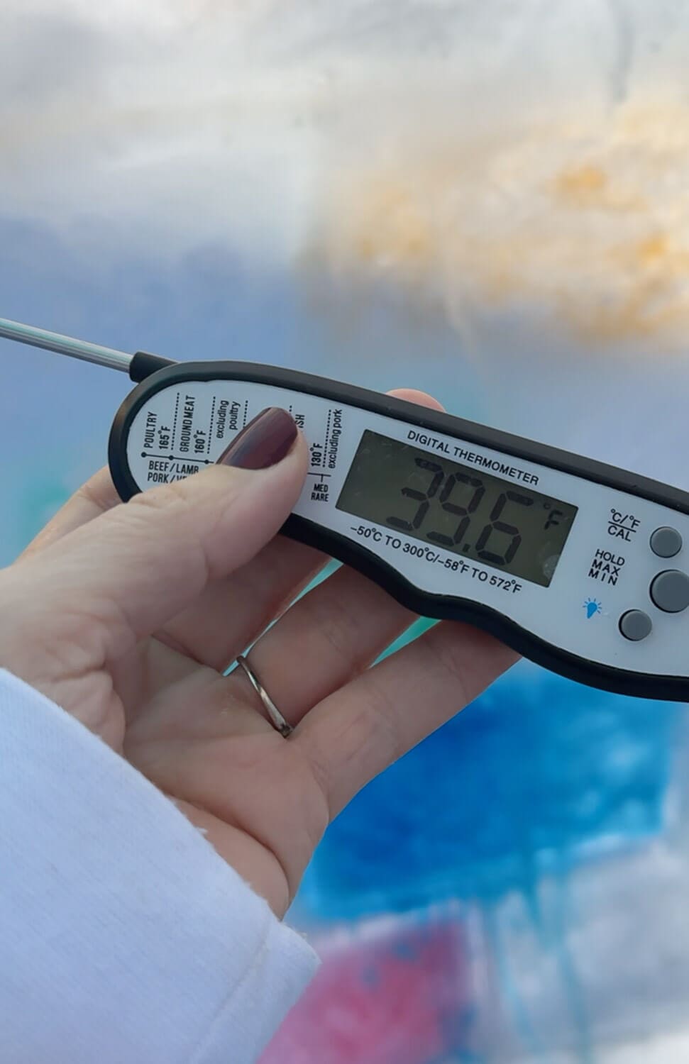 Digital meat thermometer reading 39.6°F used to track outdoor temperature.