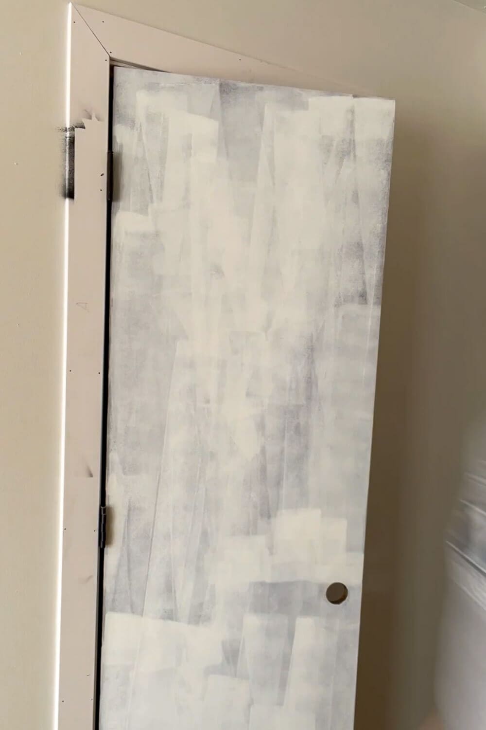 Primed interior door with trim frame ready for paint