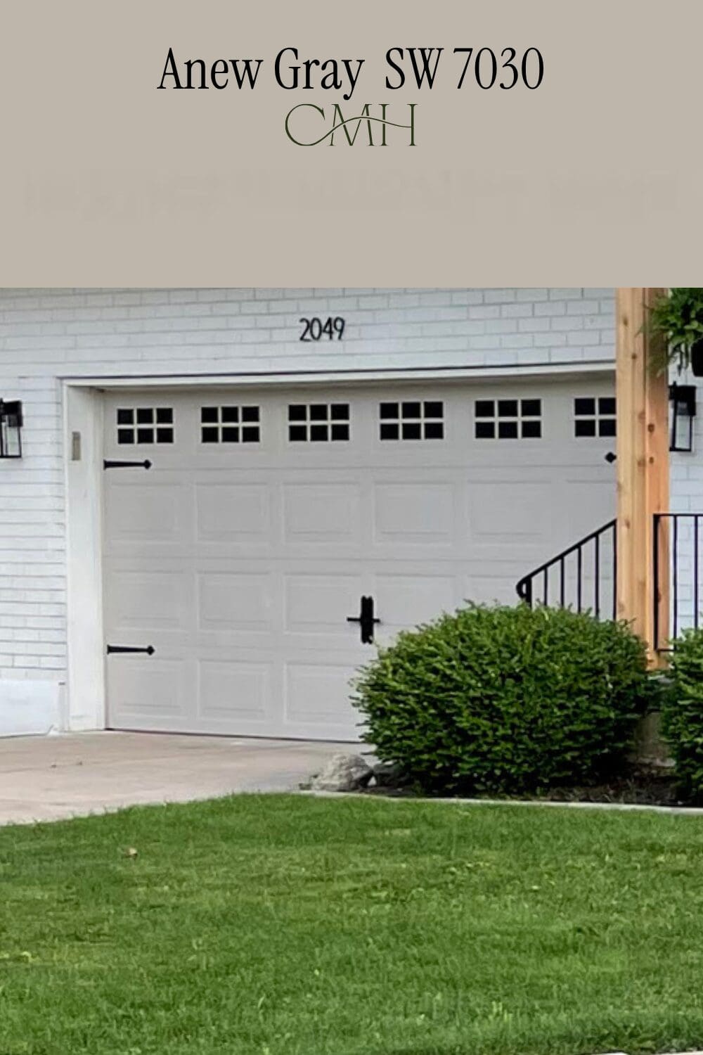 SW 7030 Anew Gray on garage door with black hardware accents and white painted brick exterior