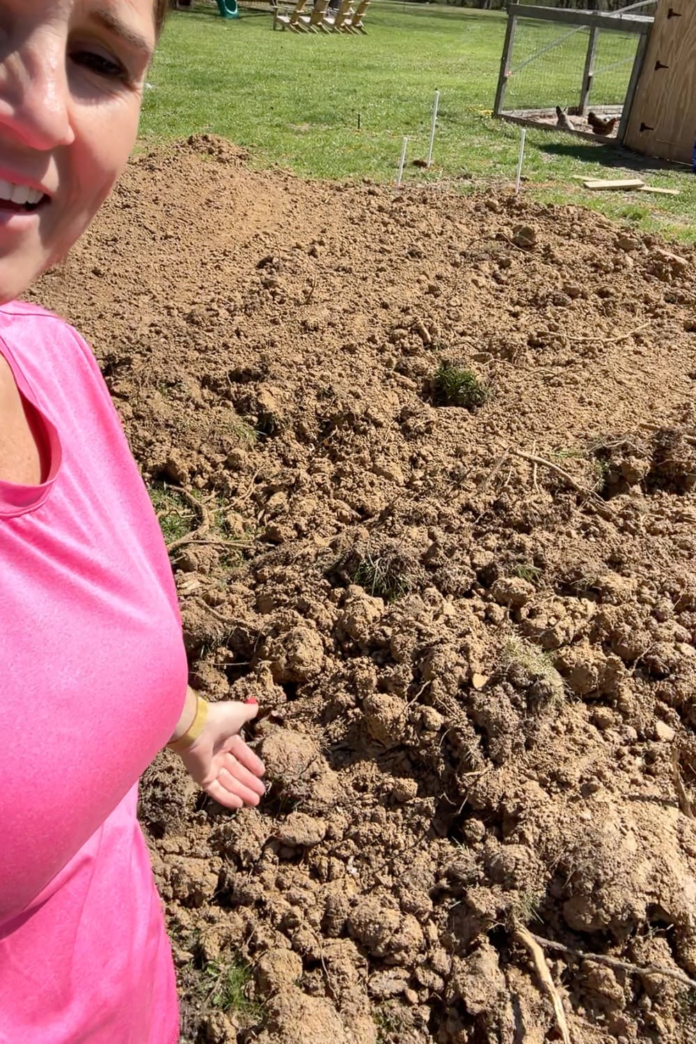 Loose dirt leftover from digging a hole to bury a trampoline in the ground. This dirt will now be used for fill dirt in low spots of the yard. 