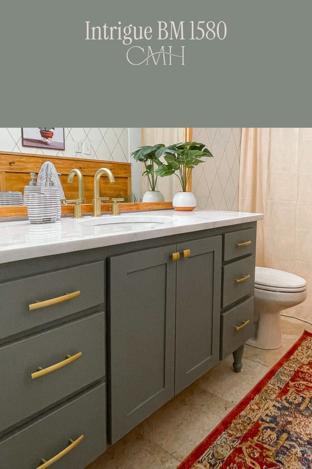 Benjamin Moore Intrigue BM 1580 on bathroom vanity cabinets with gold hardware and white marble countertop
