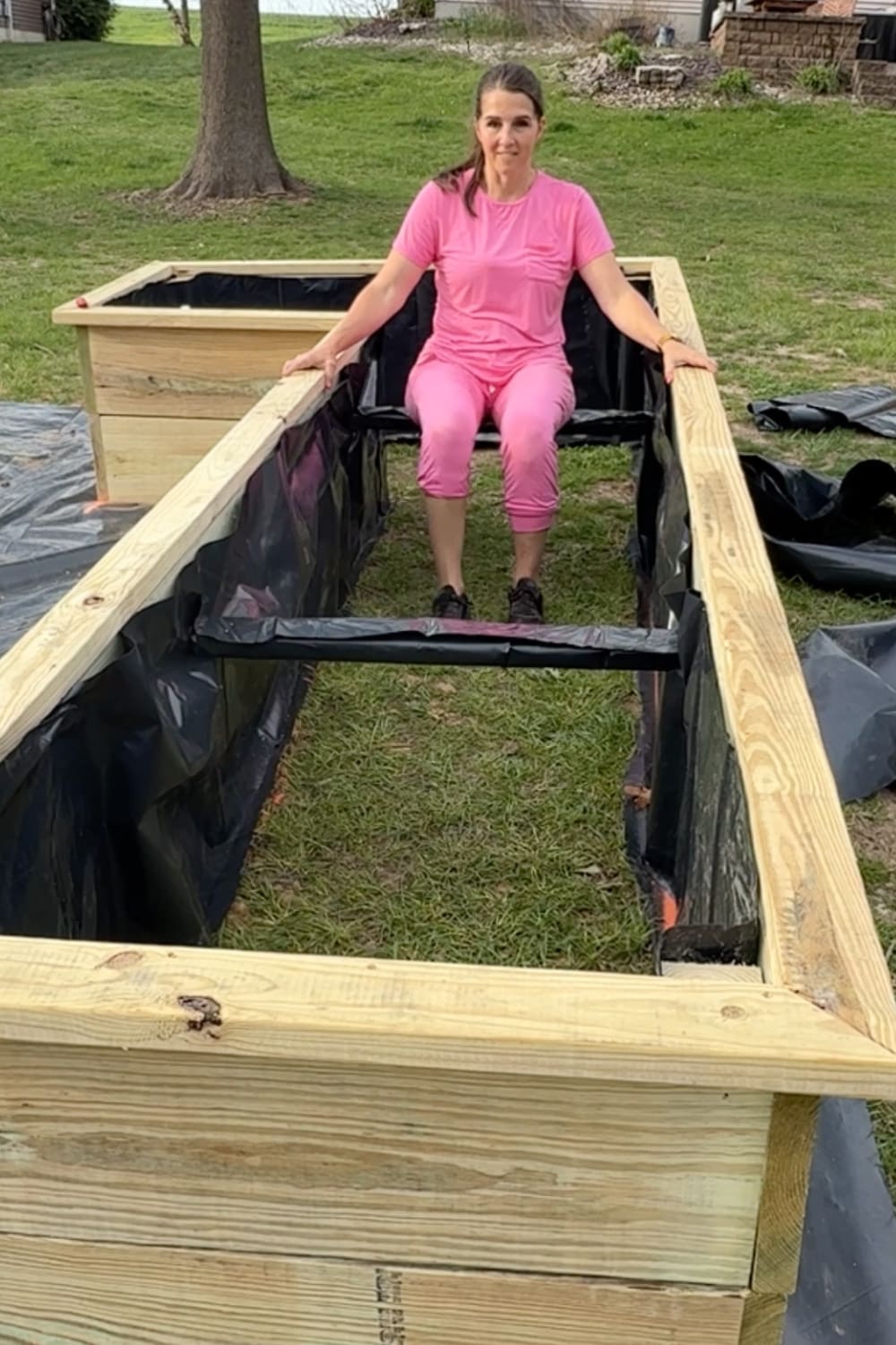 Lining inside of raised garden beds with plastic while keeping the bottom open for drainage