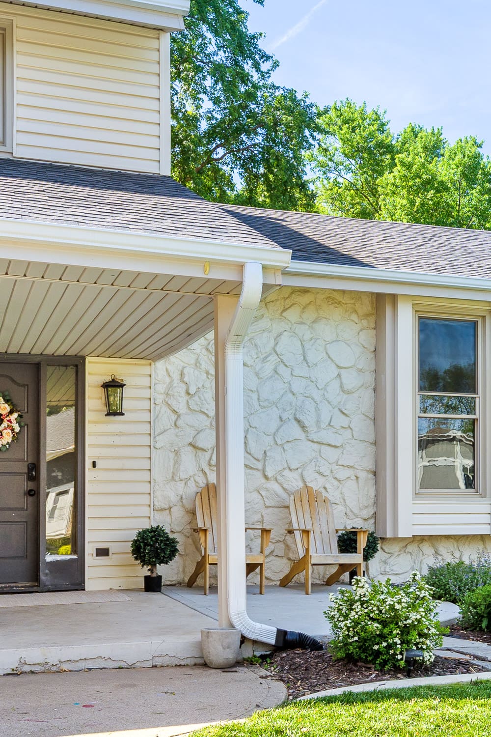 Nebraska home exterior after painting rock with Cream Match custom color to blend with existing cream siding