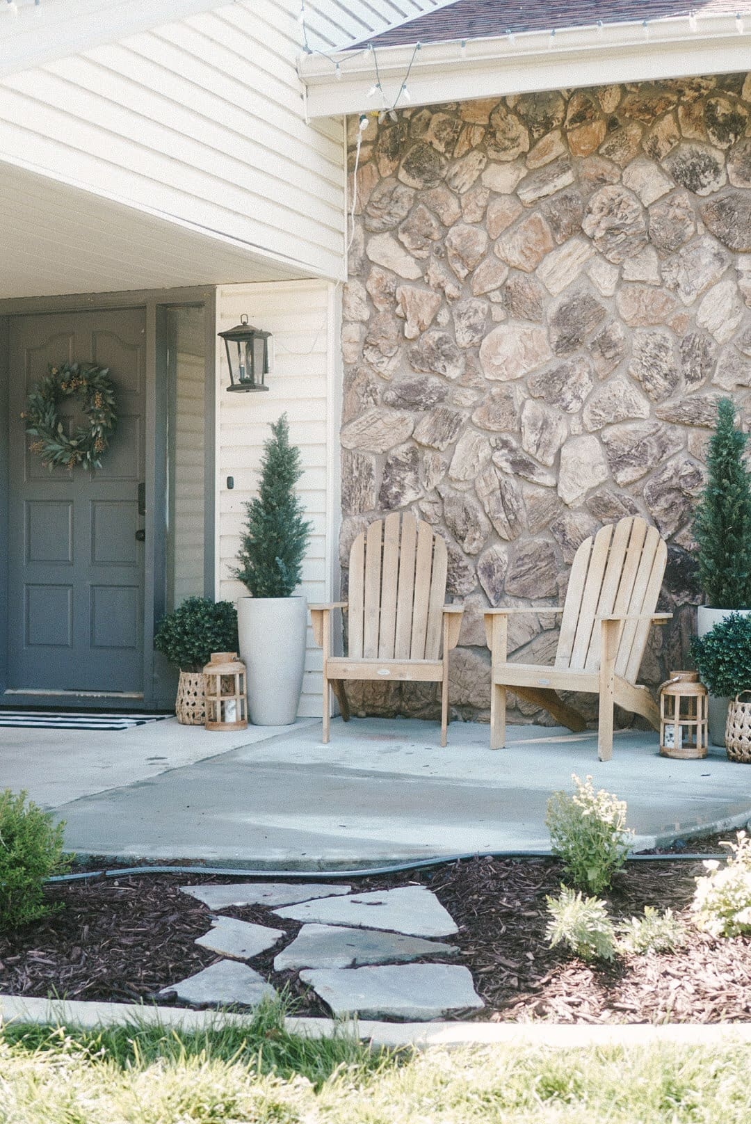 Nebraska home exterior before painting rock with natural stone and cream colored siding