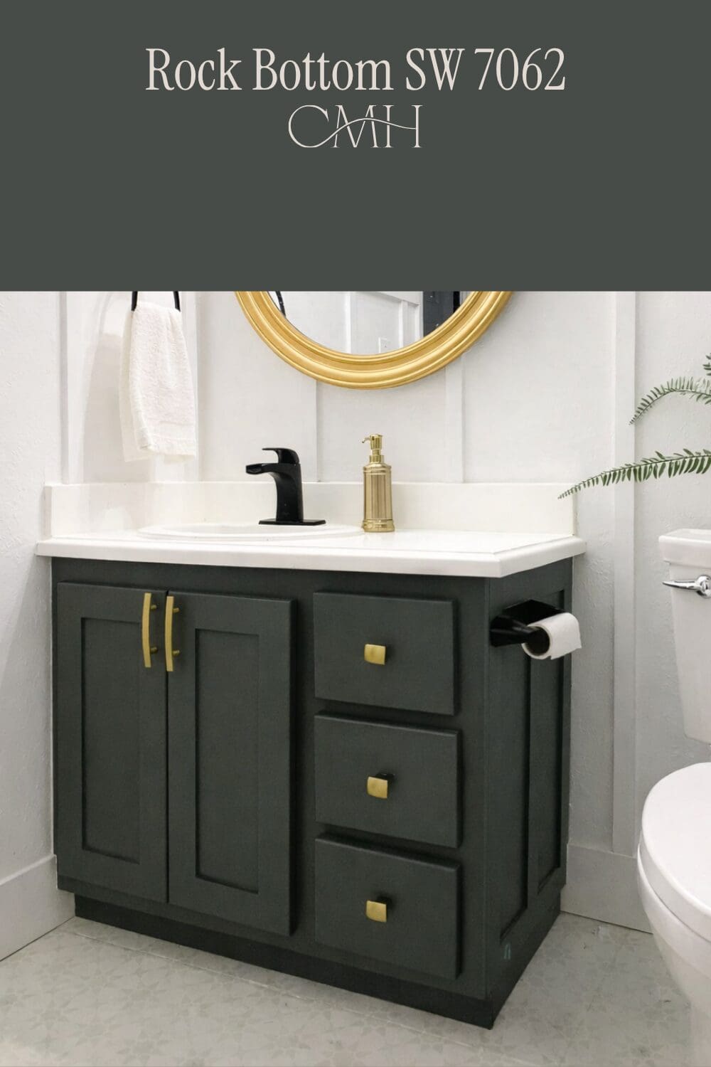 SW 7062 Rock Bottom on bathroom vanity with gold hardware, black faucet and gold round mirror