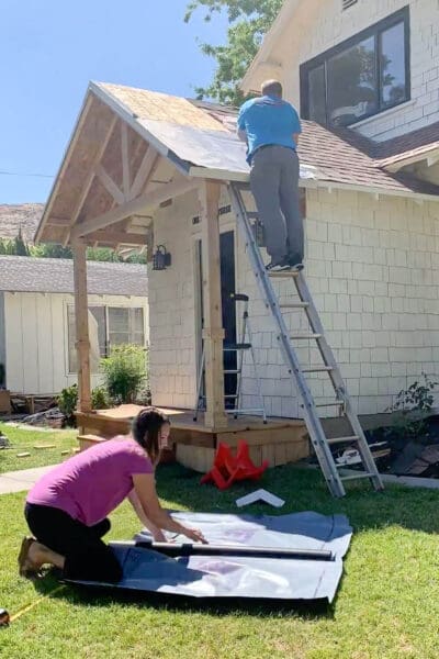 Cutting underlayment on ground before installing on porch roof