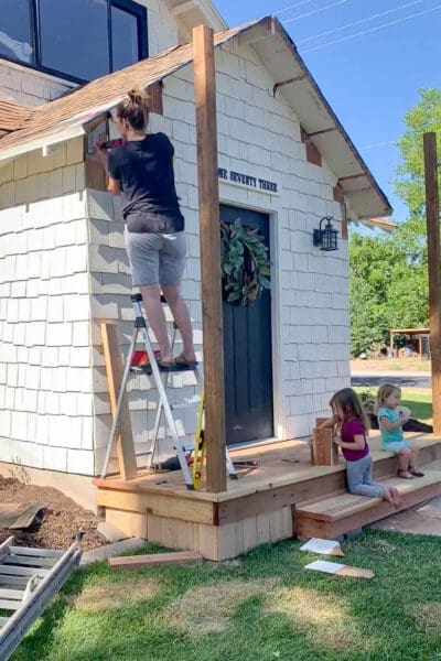 Metal bracket installation when building a porch roof into solid house framing