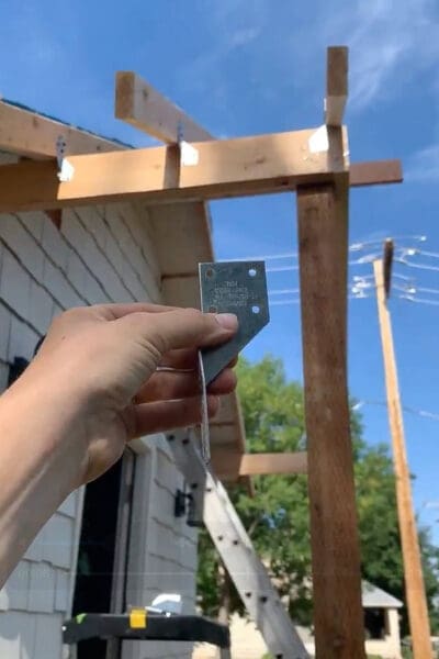 Rafter spacing and hurricane tie installation for securing porch roof frame