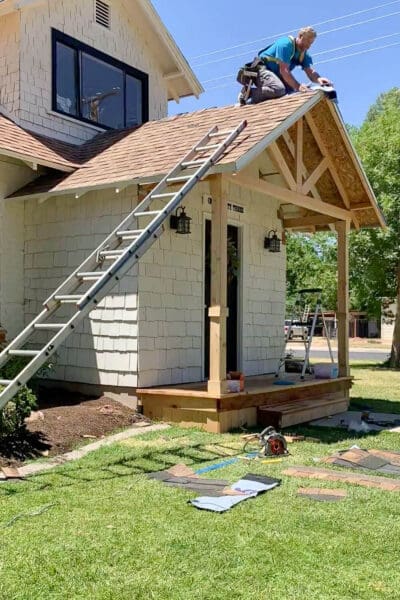 Installing shingles on a DIY porch roof to match the house