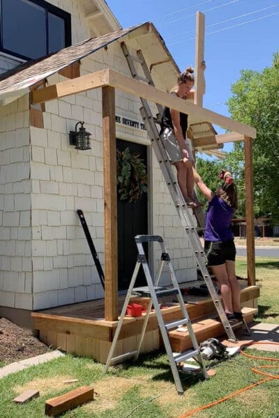 Setting vertical support post for ridge board when building a porch roof