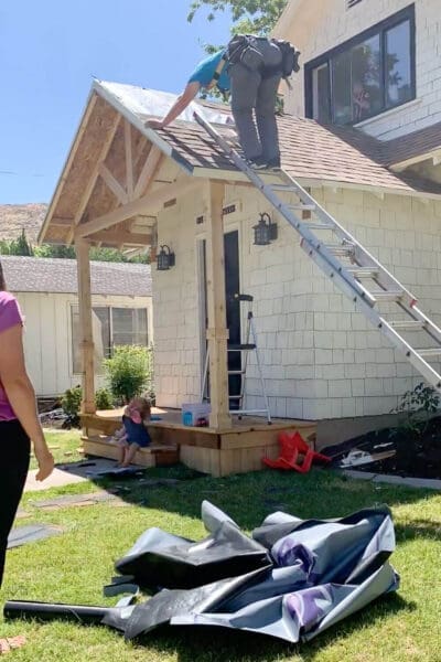 Installing shingle rows on gable porch roof from bottom to top